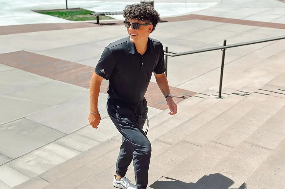 young man walking up a set of stairs
