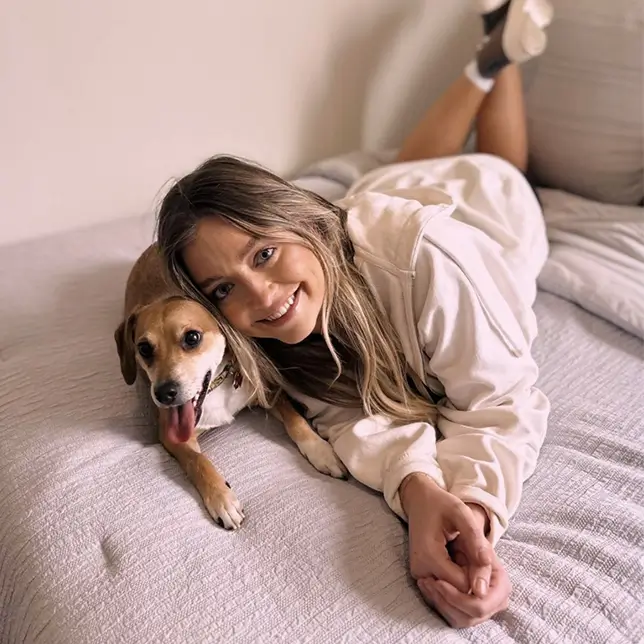 young woman relaxing with her dog